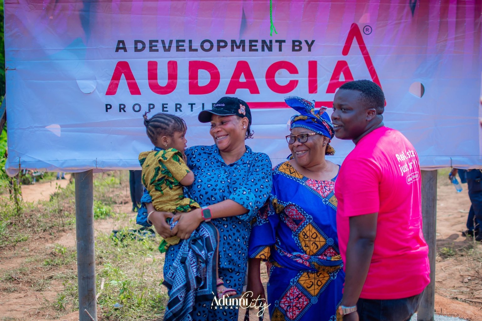 Audacia team meeting visitors at a property event